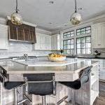 Custom Wood Work, Quartz Backsplash and island, Heathered Absolute Black Granite Perimeter Countertop, Hickory Perimeter Island Countertop, Sunpan Barstools, Black Painted Mullions, Riverside, Greenwich