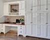 Cork Tiles, White Cabinets, Nickel Hardware